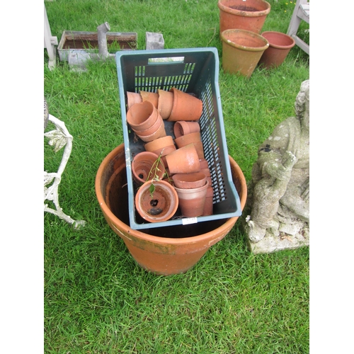 6128 - A large terracotta planter and quantity of small terracotta pots, 41cm tall     (E) £20-30