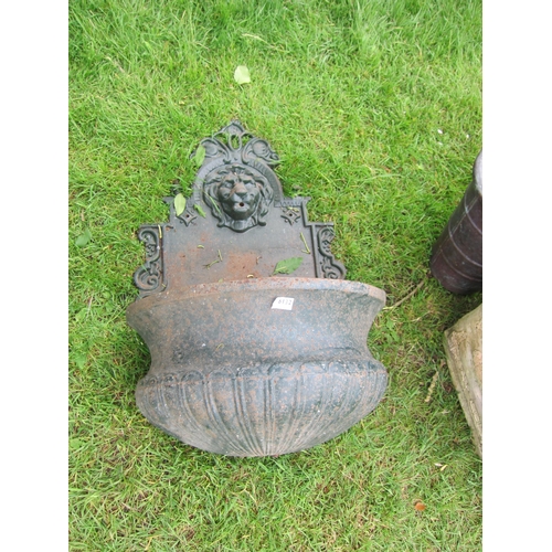 6132 - A late 19th/early 20th Century cast iron wall mounting fountain with lion mask spout, 84cm x 47cm