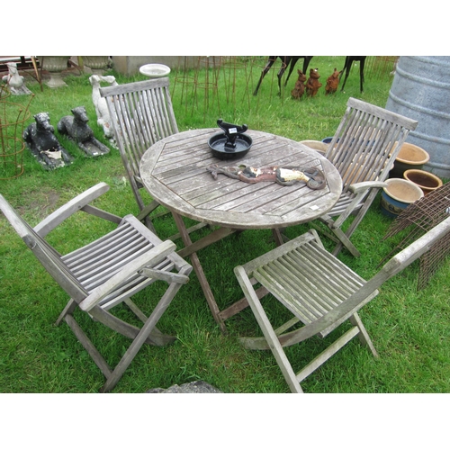 6149 - A circular hardwood garden table and four chairs