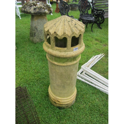 6523 - A buff terracotta capped chimney pot