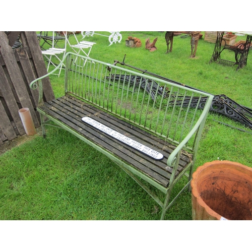 6541 - A French rivetted garden bench with scrolled arms and wooden slats