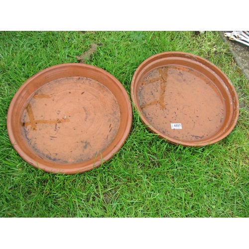 6557 - A pair of terracotta saucers