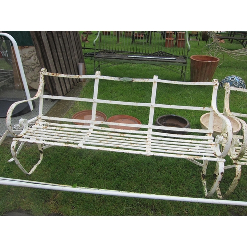 6558 - A pair of strap iron benches with Faulkners Ltd plaque to back, each bench 58.5