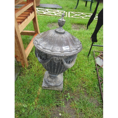 6565 - A 19th Century lead finial urn with swag detail, 23