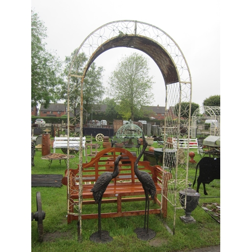 6567 - An early 20th century decorative wirework and steel garden arch