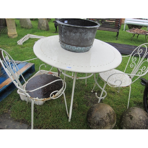 6569 - A round metal bistro table and three scroll arm chairs    (E) £15-30