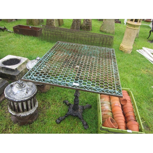 6574 - A cast iron based table with metal lattice top    (R) £80