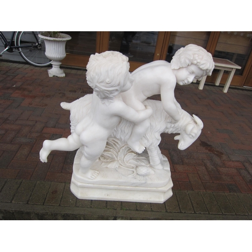 6593 - A mid 20th Century Italian Carrara marble carved figural group depicting two Putti playing on a goat... 