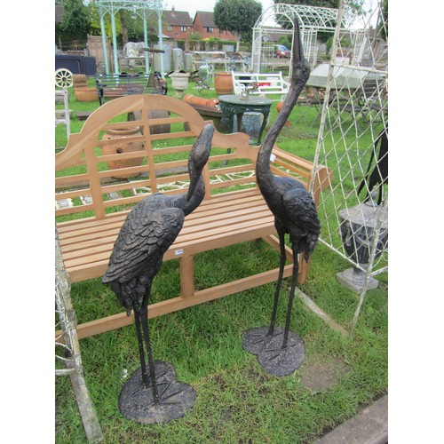 6594 - Two bronzed lifesize standing herons/cranes