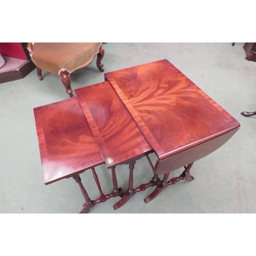 4009 - In the manner of 'Bevan and Funnell', a crossbanded flame mahogany nest of three graduating occasion... 