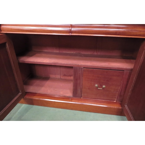 4026 - A Circa 1860 mahogany chiffonier, the raised back over carved corbels and two cushion frieze drawers... 
