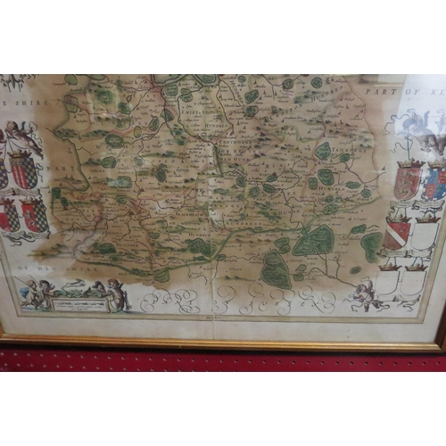 4051 - A map of Surrey on colour, double sided with Latin to back. Framed and glazed. 44cm x 54cm image siz... 