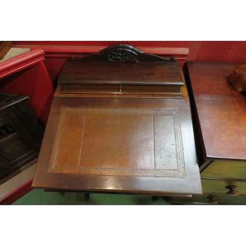 4052 - A Circa 1900 mahogany Davenport, the raised top with fitted interior and key over a rising tooled le... 