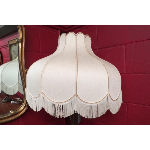 4131 - A reeded standard lamp with tasselled shade