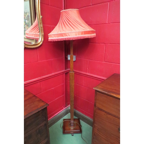 4135 - An Art Deco oak standard lamp on graduating square tapering column and stepped square base with shad... 