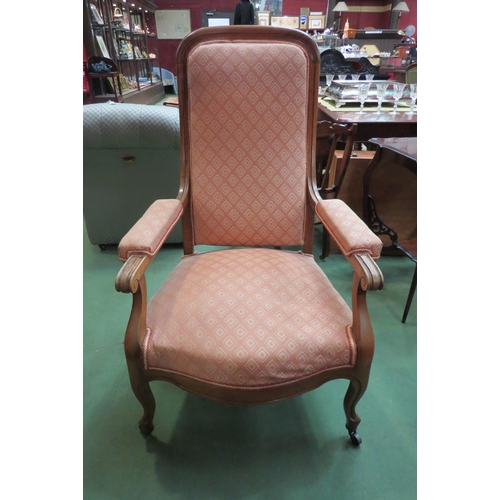 4157 - A Circa 1900 American armchair, scroll arms on castors  (R)  £25