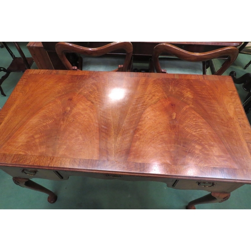 4162 - A George III revival flame walnut and crossbanded side table/lowboy with three drawers and shaped ap... 