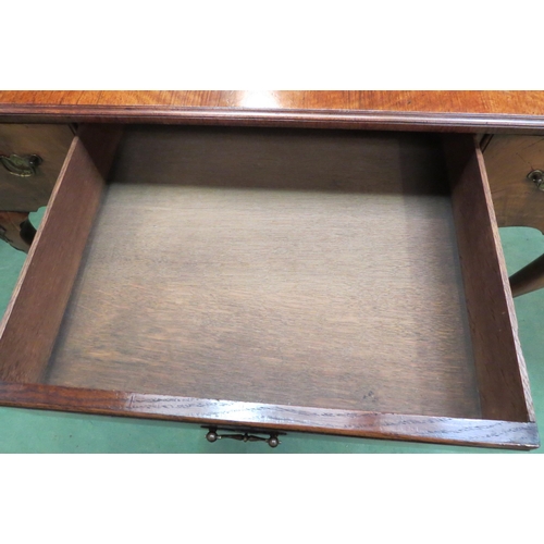 4162 - A George III revival flame walnut and crossbanded side table/lowboy with three drawers and shaped ap... 