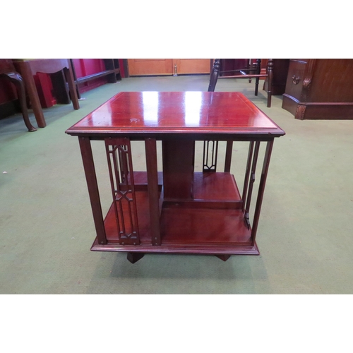 4163 - An Edwardian crossbanded mahogany table-top revolving bookshelf, 35cm tall