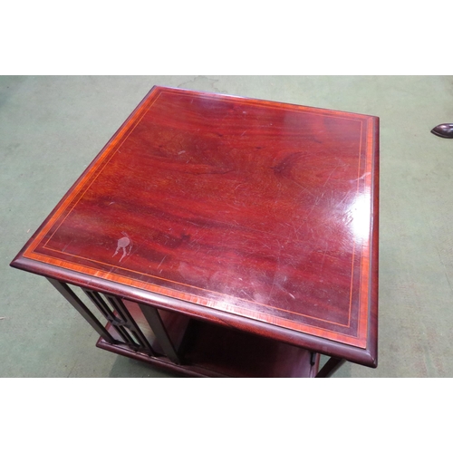 4163 - An Edwardian crossbanded mahogany table-top revolving bookshelf, 35cm tall