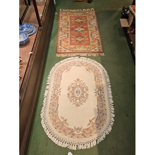 4171 - A peach ground Eastern wool rug, three central gulls and stepped border together with a chinese oval... 