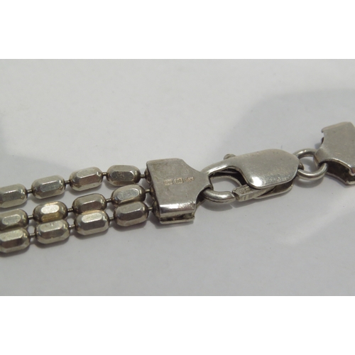 4301 - A silver bead link triple strand necklace.  Approximately 35g