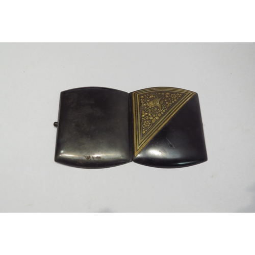 4303 - A damascene cigarette case with dragon and floral decoration