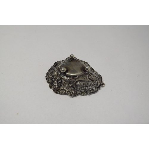 4304 - A silver heart shaped bonbon dish with pierced and embossed decoration on three ball feet.  Birmingh... 