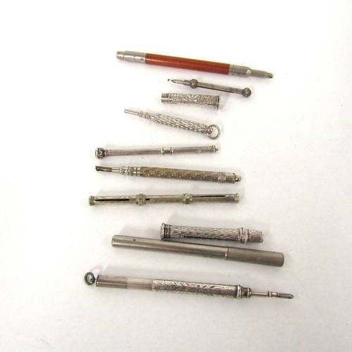 4330 - Approximately eight pencils some propelling in varying states and a container with leads including E... 