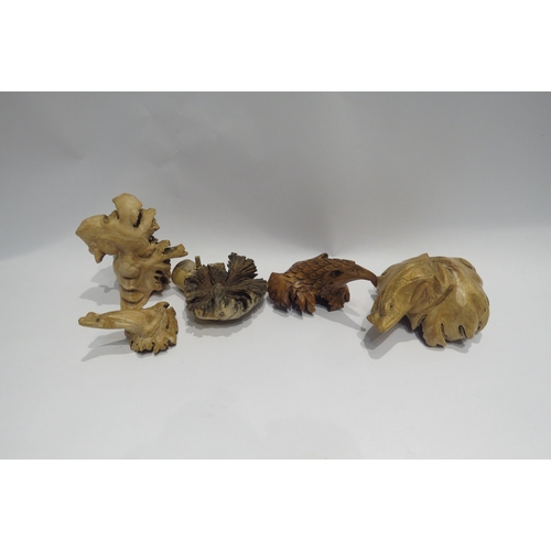 4320 - Five wooden tree stump carvings including frog and eagle's head