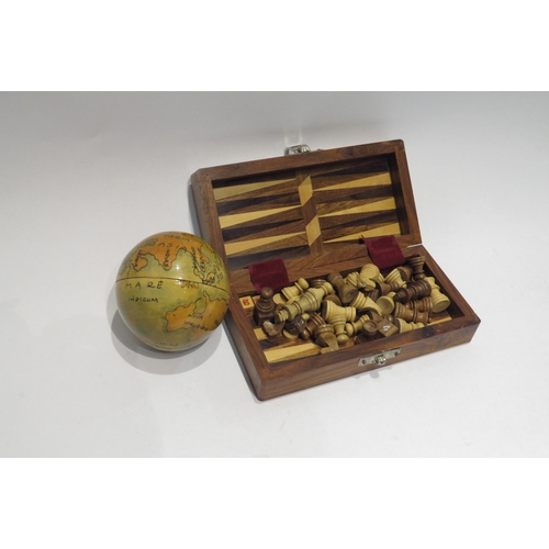 4340 - A small wooden travel chess set and a nesting globe set