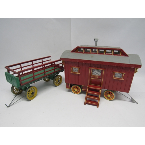 7383A - A scratch built painted wooden model of a gypsy caravan with roof lifting off to reveal fitted inter... 