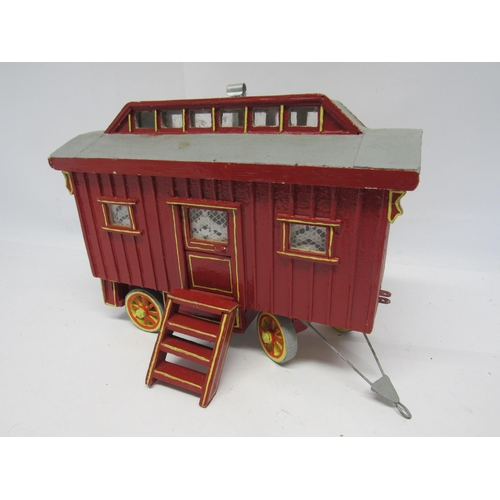 7383A - A scratch built painted wooden model of a gypsy caravan with roof lifting off to reveal fitted inter... 