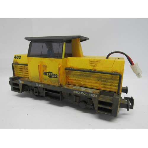 7355 - Three playworn items of G scale garden railway rolling stock to include Playmobil 'PM Cargo' diesel ... 