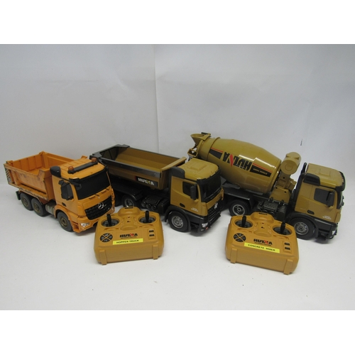 7067 - Two radio control plastic Hulna construction vehicles to include concrete mixer and hopper truck, to... 