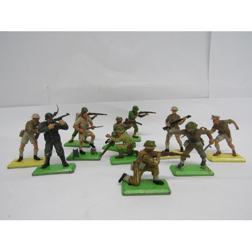 7052 - A collection of assorted playworn plastic soldiers including eleven Britains Deetail examples on met... 