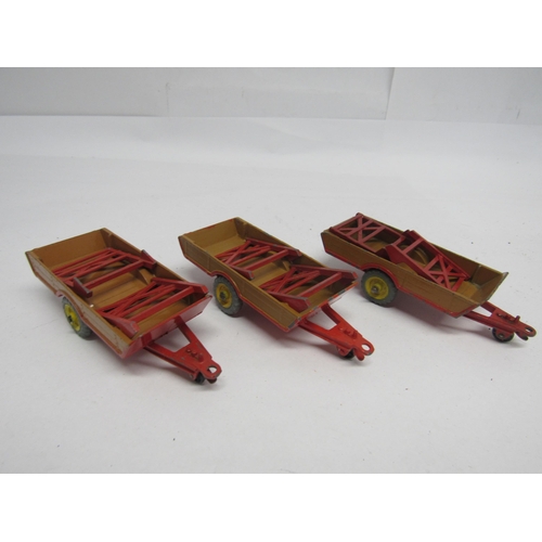 7274 - Three Dinky Toys trade boxes containing diecast farm models, to include 320 / 27B Harvest Trailer (x... 