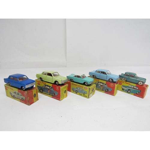 7270 - Five Dinky Toys diecast model cars, housed in yellow and red pictorial card boxes, to include 134 Tr... 