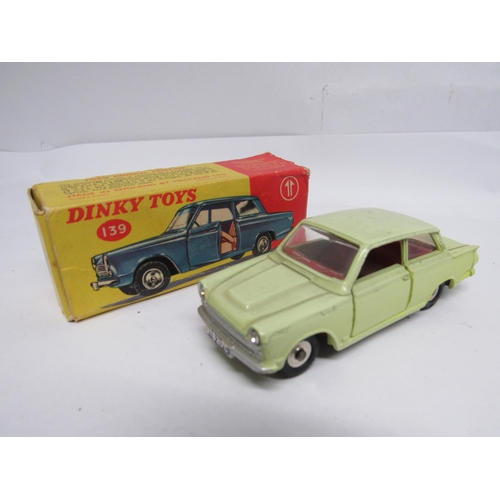 7270 - Five Dinky Toys diecast model cars, housed in yellow and red pictorial card boxes, to include 134 Tr... 