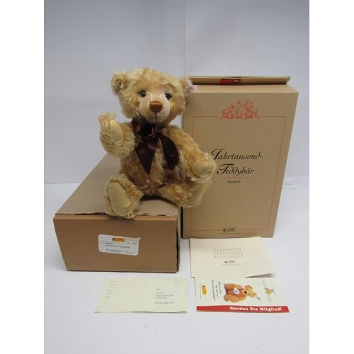 7100 - A boxed Steiff limited edition 670374 Millennium Bear, the articulated blonde mohair teddy bear with... 