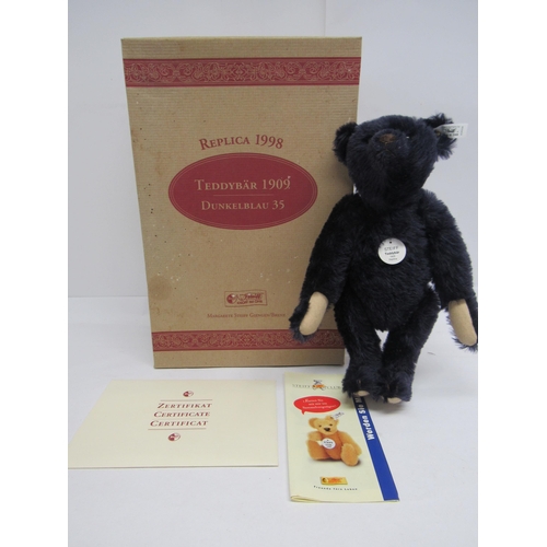 7111 - A boxed Steiff limited edition 406508 Teddy Bear 1909 Replica, the articulated dark blue mohair bear... 