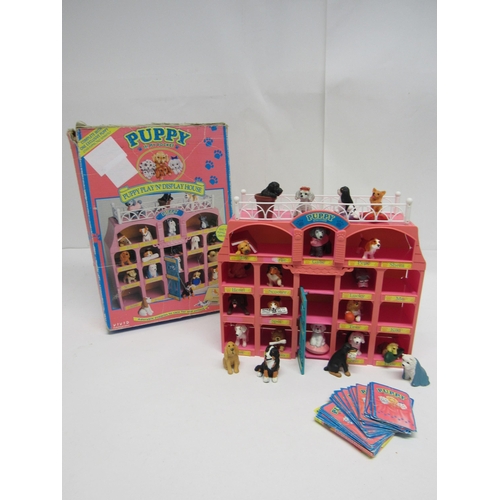 7021 - A boxed Vivid imaginations Puppy In My Pocket Puppy Play 'N' Display House with twenty-two dog figur... 