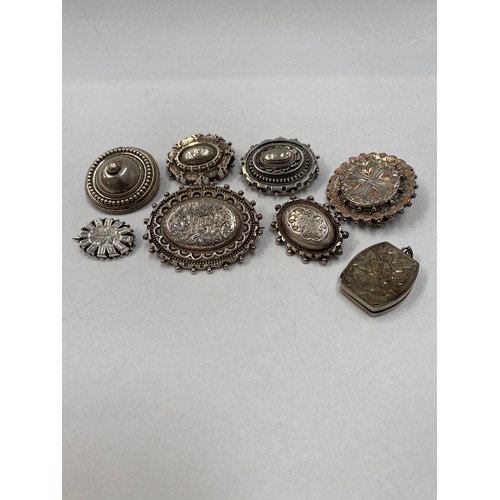 4296 - Eight silver lockets and brooches  (R)  £40