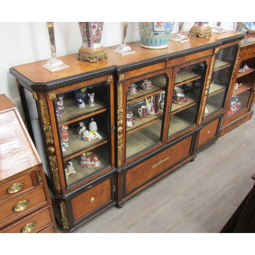 1018 - A 19th Century walnut credenza, the glazed breakfront with ebonised dentil moulding, ormolu mounts, ... 