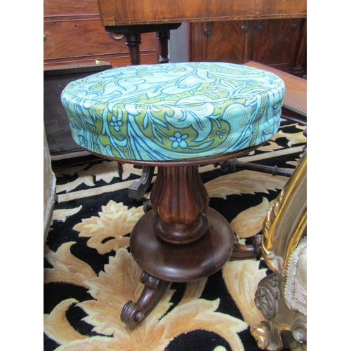 1097 - A Victorian mahogany piano stool with needlepoint seat, fluted column to scroll feet