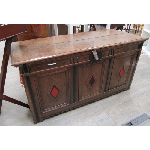 1105 - An 18th Century oak coffer fielded front with painted decoration, iron lock, hinges loose 64cm tall ... 