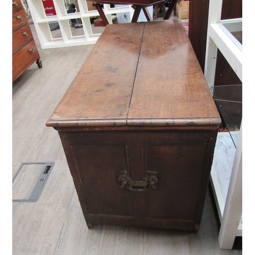 1105 - An 18th Century oak coffer fielded front with painted decoration, iron lock, hinges loose 64cm tall ... 