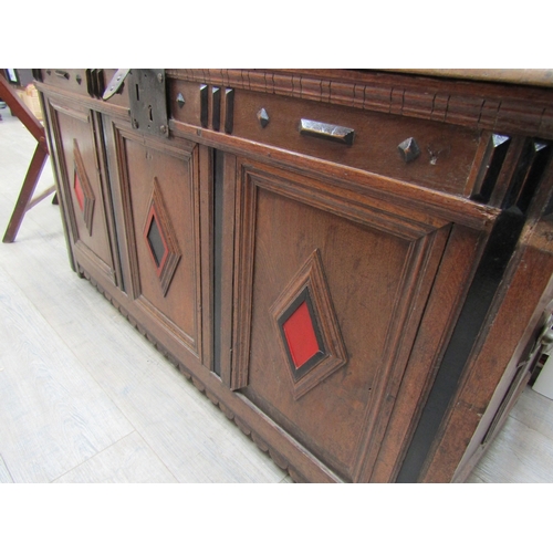 1105 - An 18th Century oak coffer fielded front with painted decoration, iron lock, hinges loose 64cm tall ... 