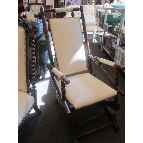 1110 - A Circa 1900 American walnut rocking chair