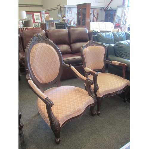 1073 - Two Victorian style ladies and gentlemen's armchairs with carved decoration